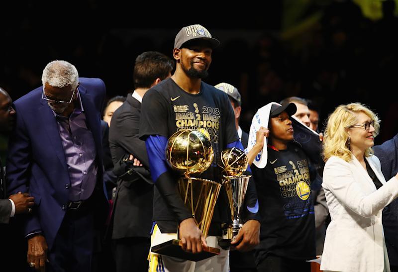 CLEVELAND, OH - JUNE 08: Kevin Durant #35 of the Golden State Warriors celebrates with the Larry O'Brien Trophy and MVP Trophy after defeating the Cleveland Cavaliers during Game Four of the 2018 NBA Finals at Quicken Loans Arena on June 8, 2018 in Cleveland, Ohio. The Warriors defeated the Cavaliers 108-85 to win the 2018 NBA Finals. NOTE TO USER: User expressly acknowledges and agrees that, by downloading and or using this photograph, User is consenting to the terms and conditions of the Getty Images License Agreement. (Photo by Gregory Shamus/Getty Images)