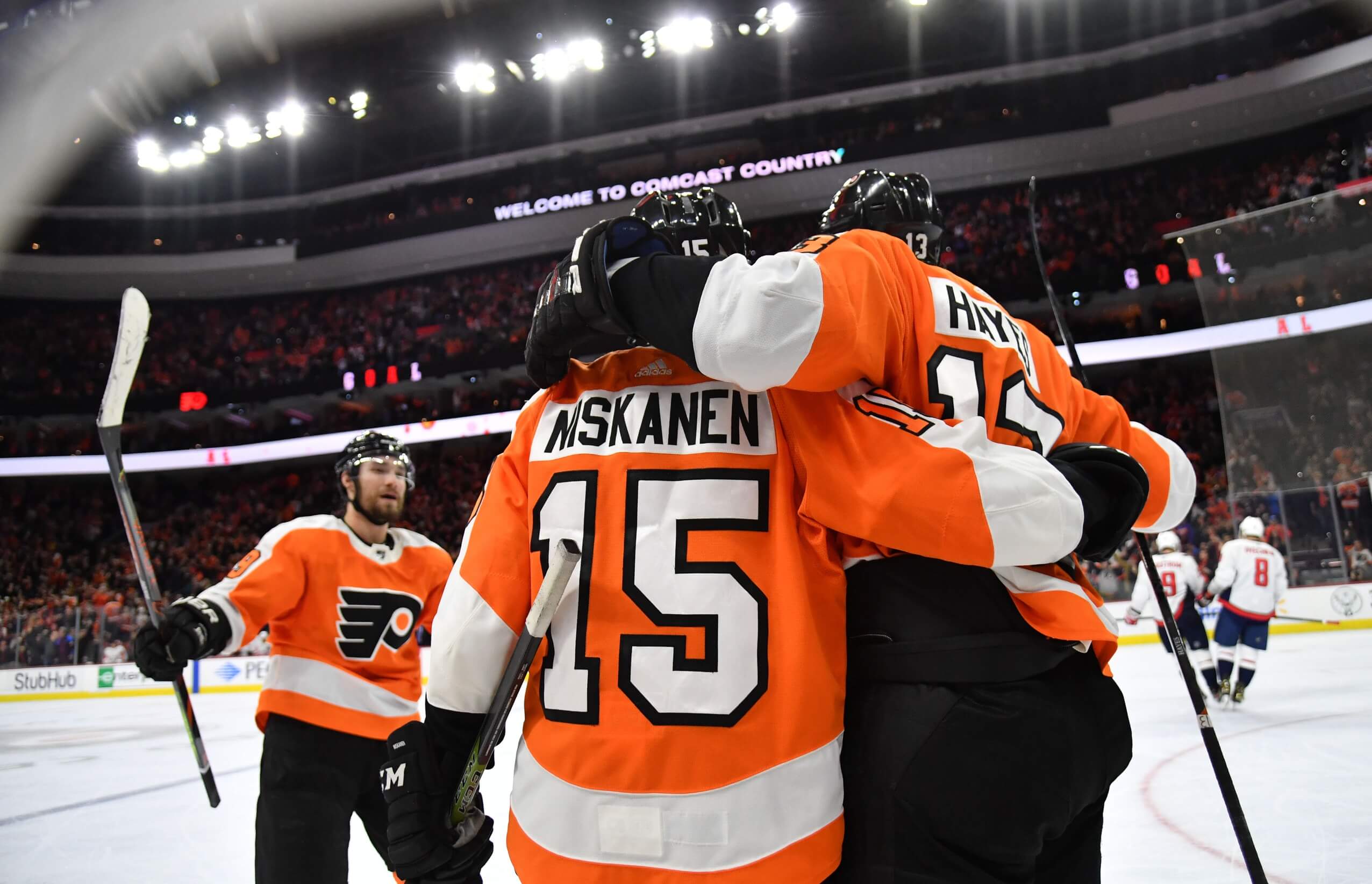 Philadelphia Flyers Players In The Locker Room Wearing Orange