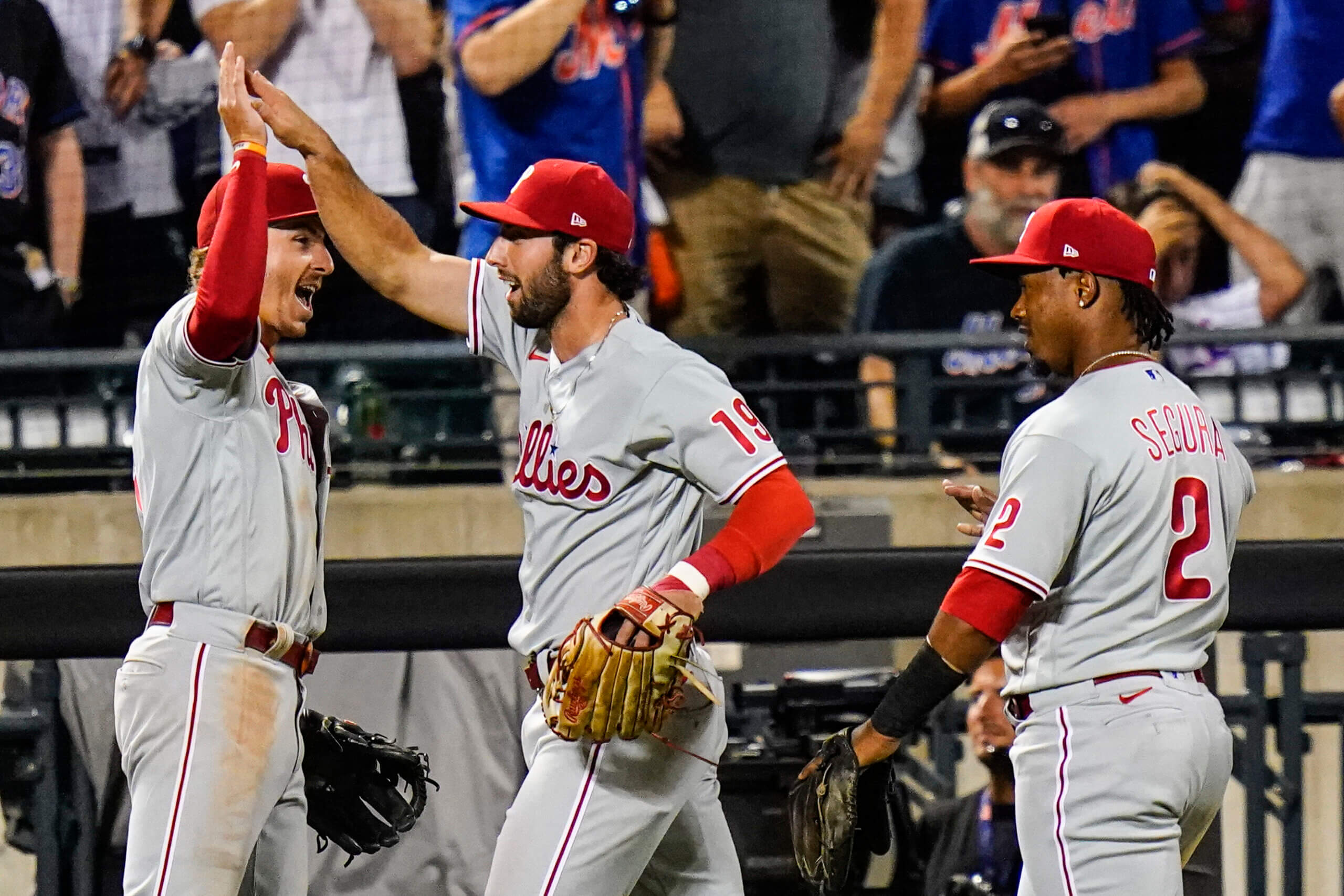 Philadelphia Phillies' Bryson Stott, right, is congratulated by Jean Segura  after hitting a home run against the San Francisco Giants during the fourth  inning of a baseball game in San Francisco, Saturday