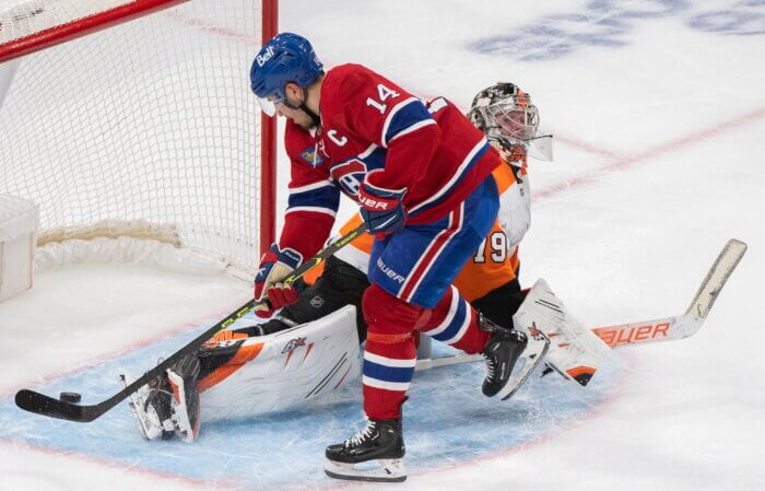 Flyers' Carter Hart scored on by Canadiens' Nick Suzuki