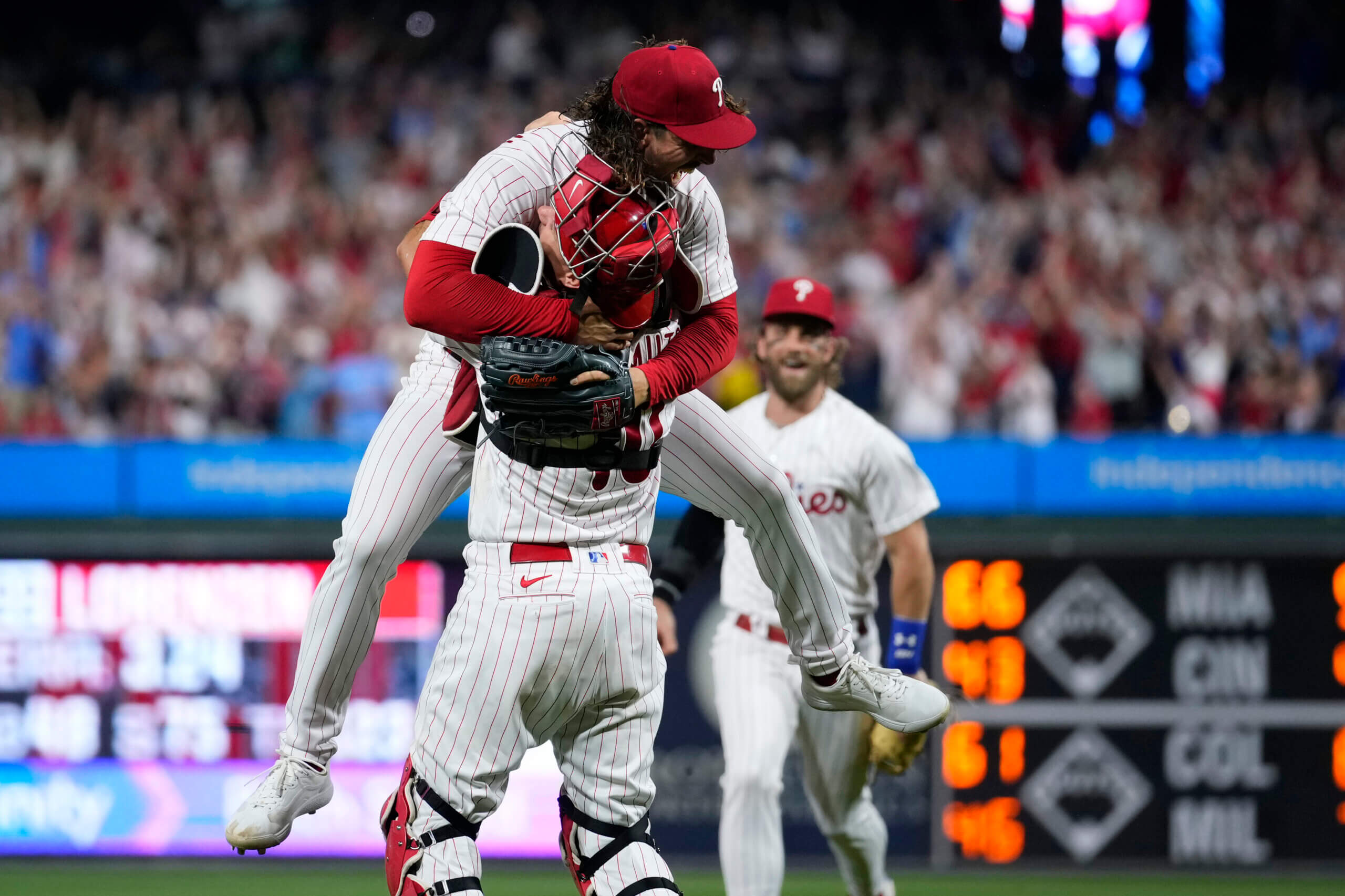 Fan carted out after falling into bullpen during Red Sox, Phillies game