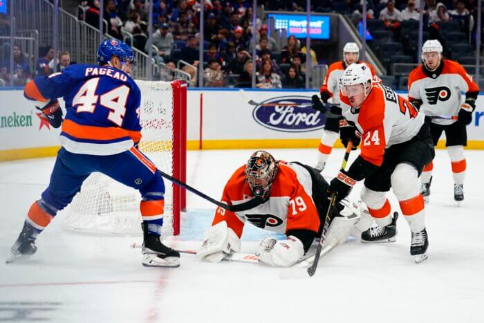 Flyers' Carter Hart makes save of the game against Islanders.