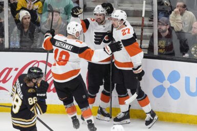 Flyers' Poehling, Hathaway, Cates celebrate.