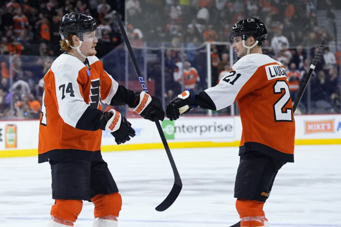 Flyers' Tippett and Laughton celebrate.
